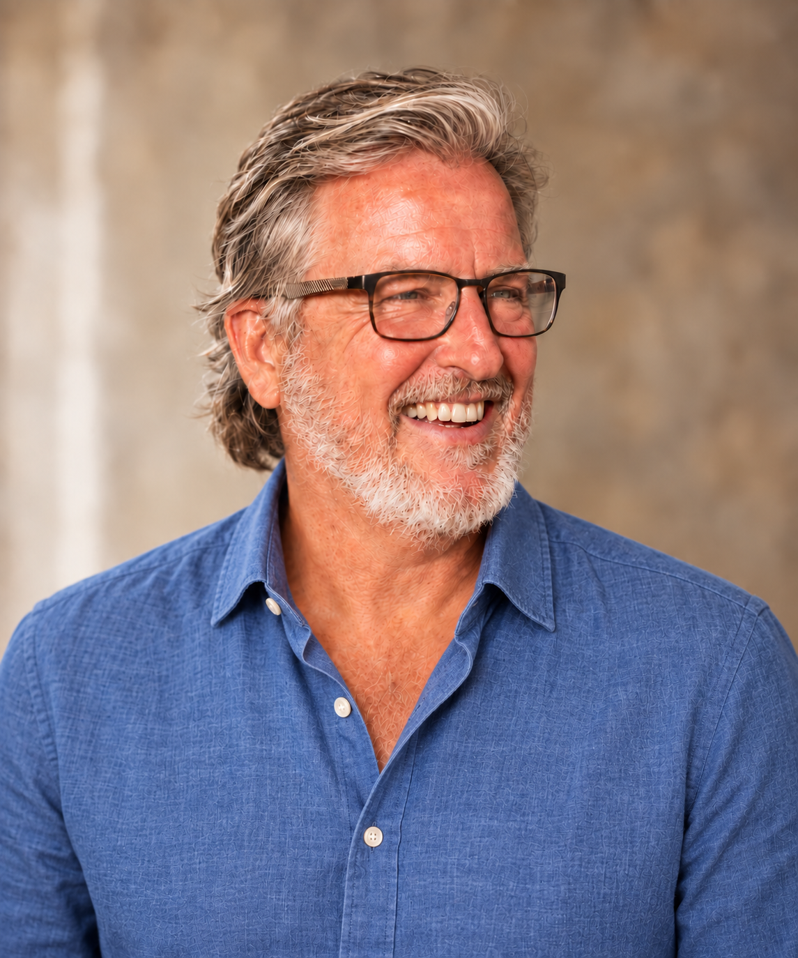 Greg Starmack smiling in a blue shirt